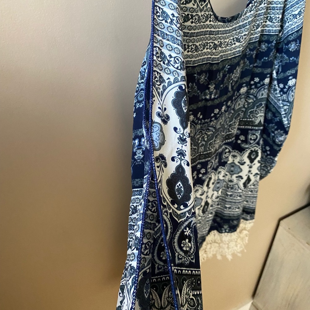 Small blue dress! Super cute open back, great length above the knees.Fun sleeves